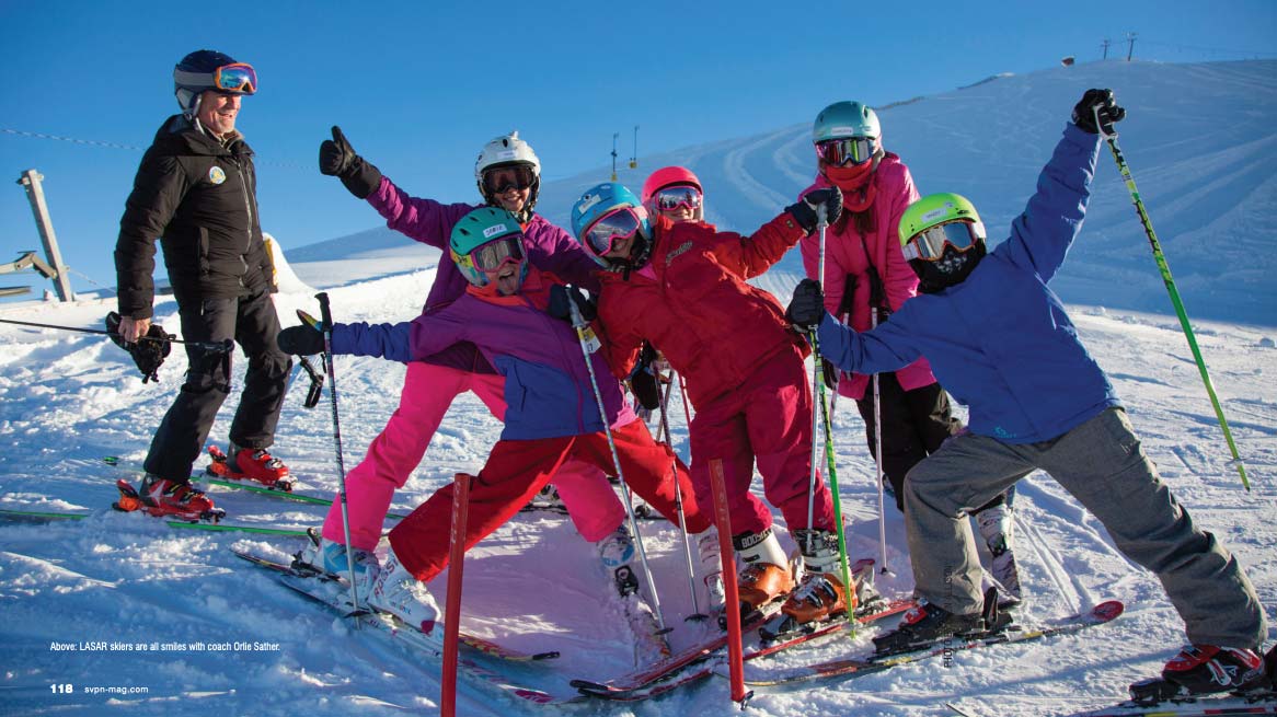 Rotarun group of skiers waving